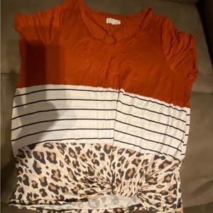 Women’s multi color top. Bottom knot